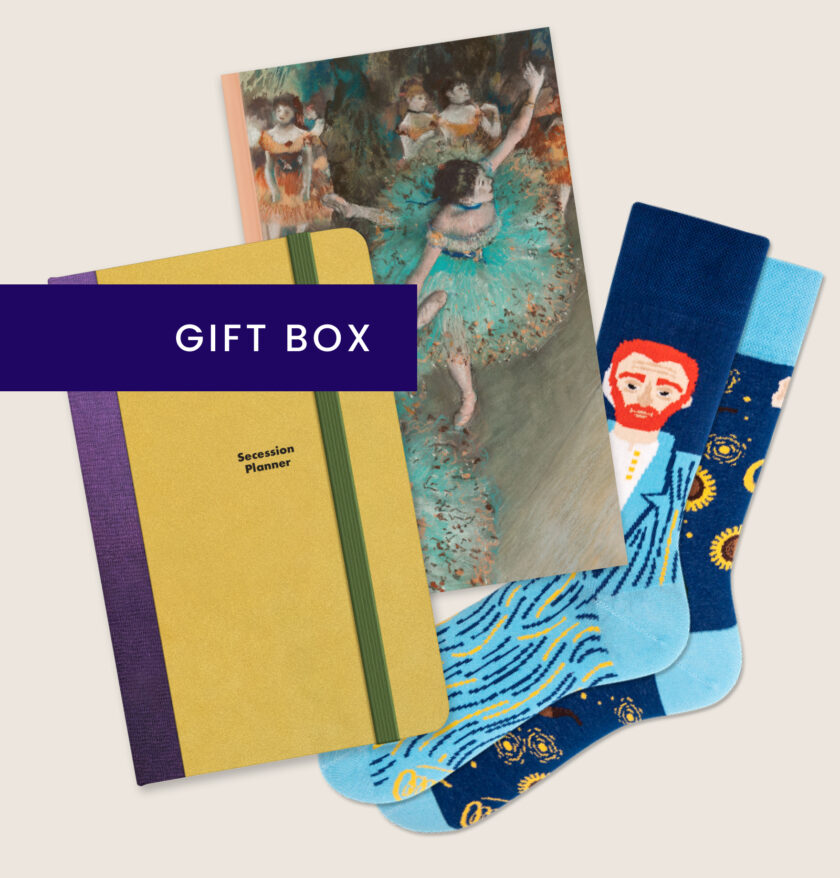 The image depicts Vienna Secession planner in a golden cover, The Impressionists notebook with a Degas' ballerina on cover and Vincent van Gogh inspired long, mismatced socks